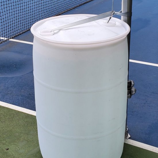 White 55 gallon water barrel